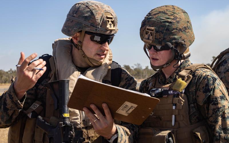 U.S. Marine Corps Capt. Ben Hicks, left, a dental officer with Combat Logistics Battalion 31, 31st Marine Expeditionary Unit, coordinates with U.S. Navy Lt. Katelyn Morton, an emergency nurse with CLB-31, 31st MEU, during a mass casualty exercise at Shoalwater Bay Training Area, Australia, on June 27, 2023.