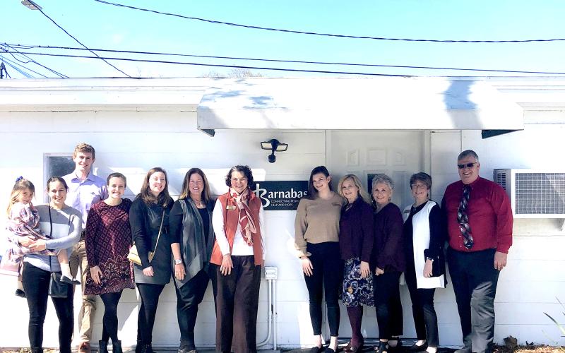 Several people join together to celebrate the opening of Barnabas’ new service center in Callahan, which is open by appointment to assist local residents. Call 904-261-7000 for assistance.