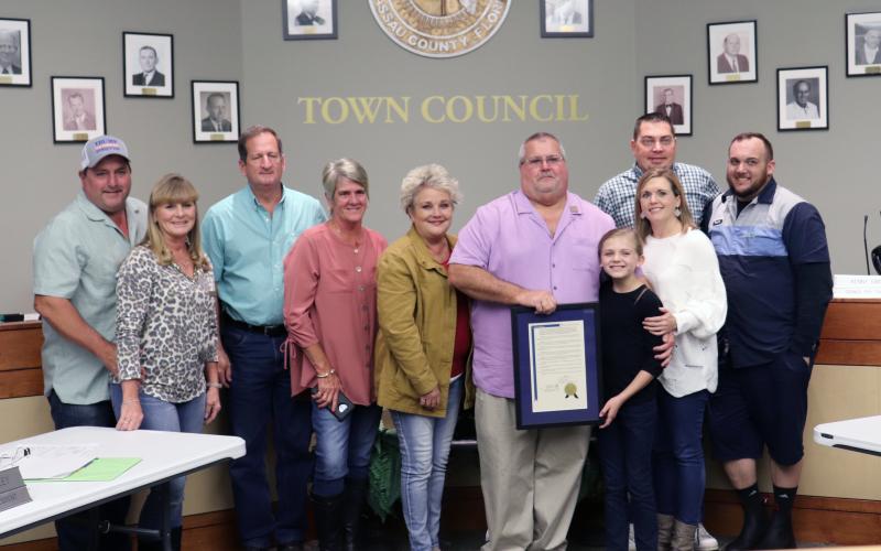 Hilliard Town Council President John Beasley is joined by family after receiving recognition for 20 years of service to the town.