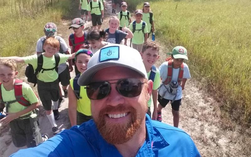 Marion County resident Steven Claytor leads Boy Scouts on an outdoor excursion recently as part of North Florida Survival and Adventure. Claytor teaches people how to survive in nature and prepare for emergencies.