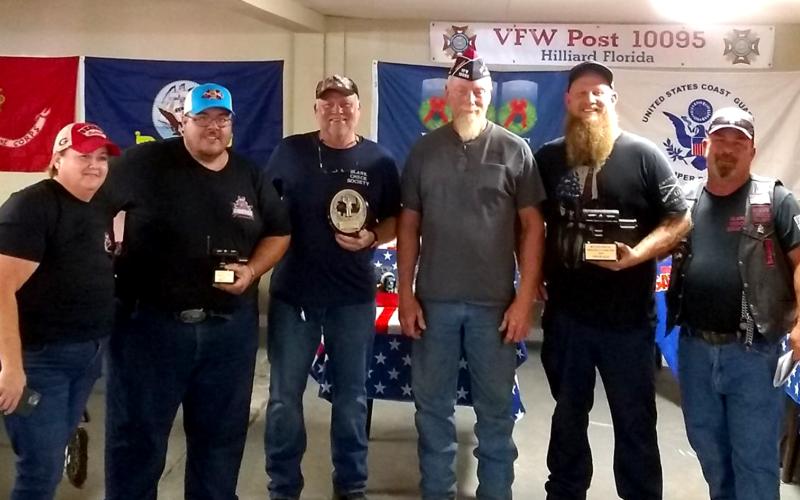 The Blank Check Society’s Fifth Annual Pork Butt Cook-Off judges are Judge Steve Fahlgren, Dennis Morris and Sheriff Bill Leeper. The BCS wrote a $7,900 check to Wreaths Across America to assist in placing wreaths on graves at Jacksonville National Cemetery.