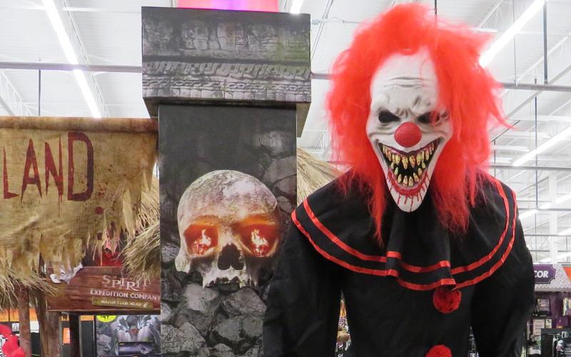 A clown gives an enthusiastic greeting to customers as they step into the scary experience that is Spirit of Halloween. JULIA ROBERTS/NEWS-LEADER