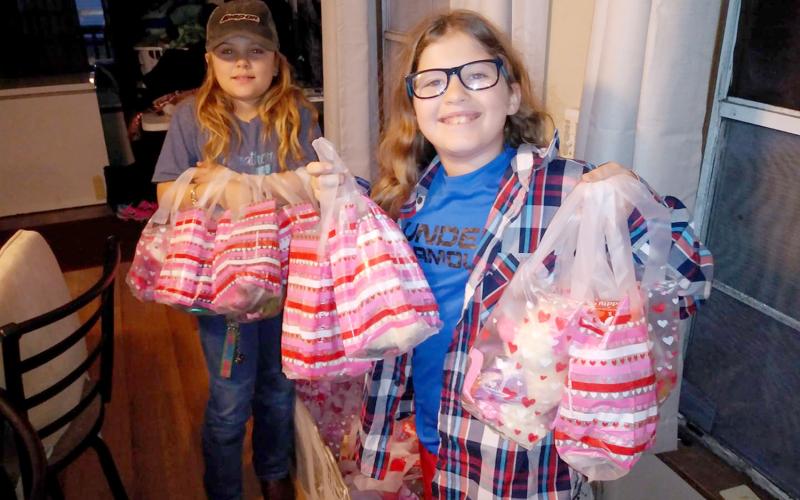 Junior Be The Change Northeast Florida volunteers prepare Valentine’s Day care packages to distribute to the homeless. The non-profit always accepts volunteers to assist with its efforts. Visit https://www.facebook.com/Be-the-Change-NE-Florida-Inc-280042779206525 to learn more.