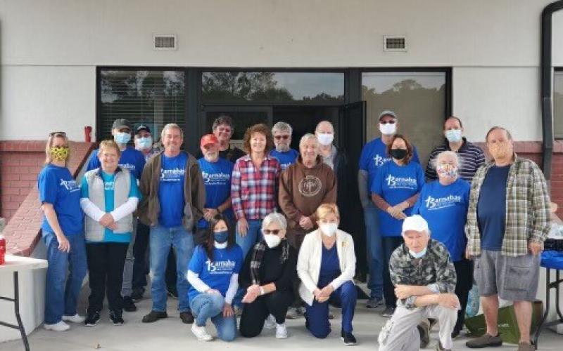 Springhill Baptist Church members and volunteers pose for a photo at the Barnabas food distribution.