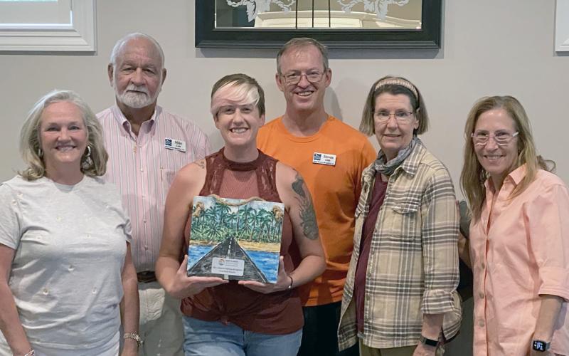 Keep Nassau Beautiful board members and staff celebrate their award, including Lynda Bell, Mike Cole, Jules Ruppel, Steven Gibb, Kelley McCarter and Jean Mauldin.