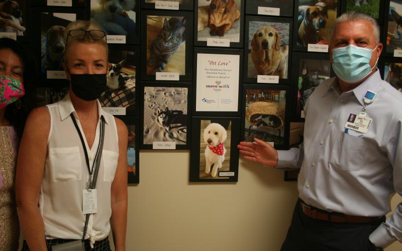 Baptist Medical Center Nassau President Ed Hubel, right, and his dog, Lilly.