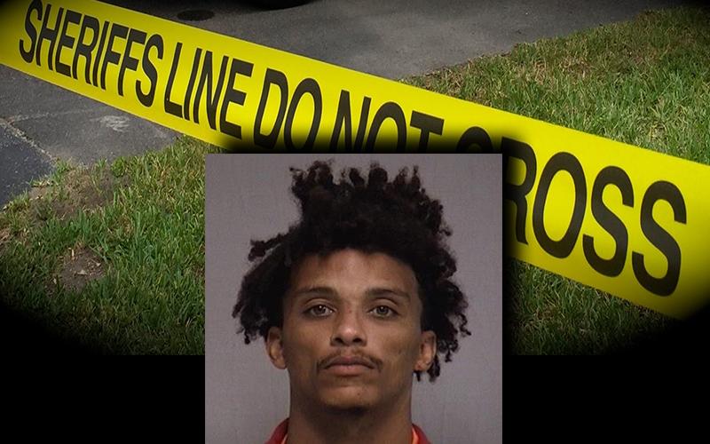 A mugshot of suspect Hicks over crime scene tape. NCSO