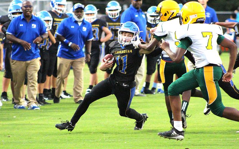 Alex Pulwicz scored a touchdown for the FBMS Pirates Thursday. BETH JONES/NEWS-LEADER