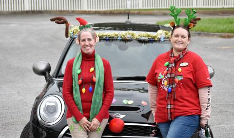 Camden library director Mellissa Clark (right) and children’s specialist Rachael Atterbery decked out themselves and “the holiday gram mobile” last week to deliver holiday cards to every senior facility in Camden County. They’d hoped to get 250 cards, so that each senior would get one. But the kindness of others surprised them as card after card came in until they had more than 1,000 to share.