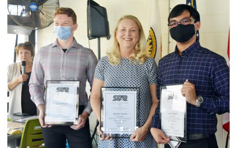 The St. Marys Kiwanis Club recognized two STAR students Monday, Karson Lewis (right) and Aaron Dino (left), for achieving the highest SAT scores. Each students gets to pick a teacher to share the recognition. Dino picked Lisa Clark (center) and Lewis chose Susan McMurray.