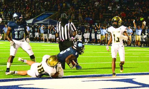 Jamie Felix scores a touchdown for the CCHS Wildcats against Oakleaf.