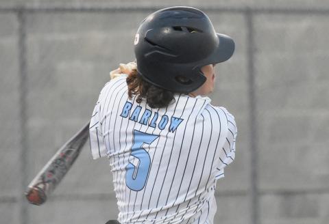 Luke Barlow smacks a hit in the Wildcats' win over Grayson. Andy Diffenderfer/Tribune & Georgian