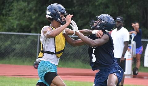 Saige Roche defends Ronald Spradley-Pettus on a long pass. (Tribune and Georgian/Andy Diffenderfer)