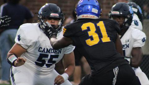 Cayden Thompson tangles with a Brunswick defender. (Scott J. Bryan, Tribune & Georgian) 