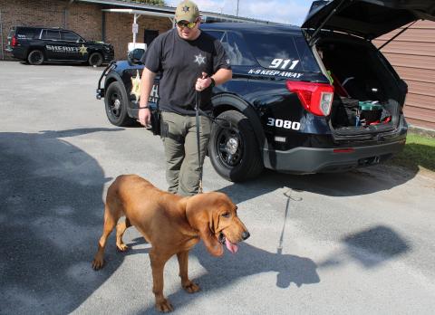 Camden County Sheriff’s Office Sgt. Jay Thames walks his K-9, Jasper, outside the sheriff’s office.
