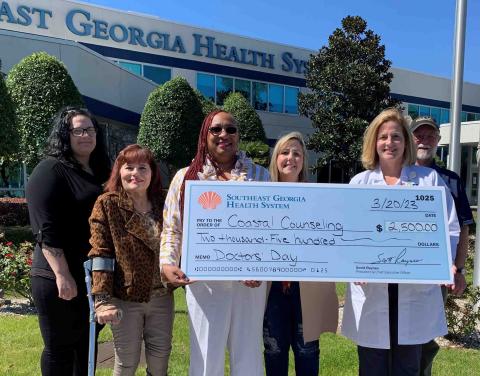 Southeast Georgia Health System Camden Campus Medical Staff Chief Dr. Janise H. Whitesell delivers a $2,500 donation to Coastal Counseling Center and its staff members, Merrisa Kight, Nannette Brannon, Leticia Graham, Tammy Hudson and Dale Blanton.