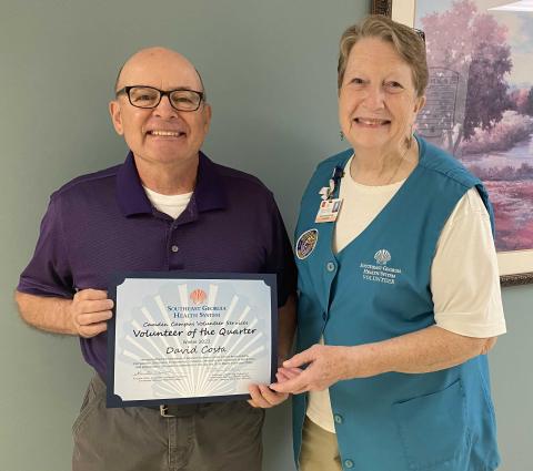 Southeast Georgia Health System Camden Campus’ Volunteer of the Quarter, David Costa, left, accepts his award from Camden Campus Volunteer Services President Kathleen Worthing.
