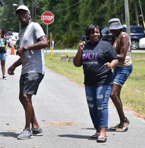 Clifton Herbert Mitchell, Kingsland Councilwoman Kristy Chance and Peggy Kennedy dance to the music.