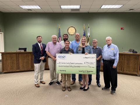 Camden County Board of Commissioners recently received $750,000 for Horse Stamp Church Road improvements. From left are County Administrator Shawn Boatright, Commissioners Lannie Brant and Trevor Readdick, Public Works Director Shalana McNamee, commission Chairman Ben Casey, Grants Manager Julie Haigler, and Commissioners Martin Turner and Jim Goodman.