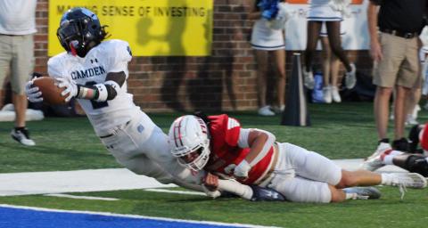 Ja’Marley Riddle stretches for the goal line against Glynn Academy. The senior scored three touchdowns in the Wildcats’ romp last Friday, two rushing and another receiving. (Scott J. Bryan, Tribune & Georgian)