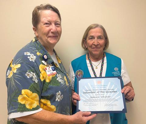 Southeast Georgia Health System Volunteer Services President Kathleen Worthing, left, presents the Summer Volunteer of the Quarter award to Joanne Wesner.