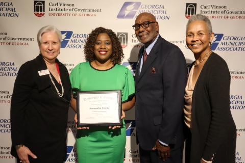 Woodbine city Administrator Samantha H. Young recently received the Harold F. Holtz Municipal Training Institute Certificate of Achievement. From left are Carl Vinson Institute Director of Governmental Training Mara Shaw, Young, Georgia Municipal Association First Vice President Fred Perriman and association Training Board member Linda Davis.