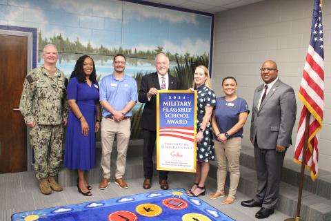 Naval Submarine Base Kings Bay Commanding Officer Capt. Chris Bohner, Camden County Schools Superintendent Tracolya Green, Camden County Board of Education Chairman Jonathon Blount, Georgia Superintendent of Schools Richard Woods, Mary Lee Clark Elementary Principal Rika Dow, Camden school board member Allison Murray and Georgia Board of Education member Nicholas Ellis celebrate Mary Lee Clark’s designation as a Military Flagship School Award winner.