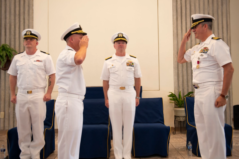 Capt. Gabriel A. Anseeuw, right, relinquishes command of Submarine Squadron Sixteen to Capt. Eric Cole, left, during a change of command ceremony aboard Naval Submarine Base Kings Bay.
