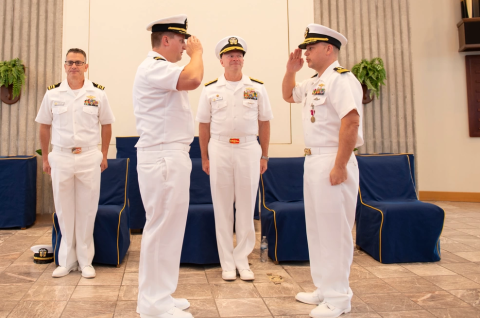 Cmdr. Matt Scovill, right, relinquishes command of Submarine Readiness Squadron 36 (SRS-36) to Cmdr. Matthew Becker on June 14 during a change of command ceremony aboard Naval Submarine Base Kings Bay.