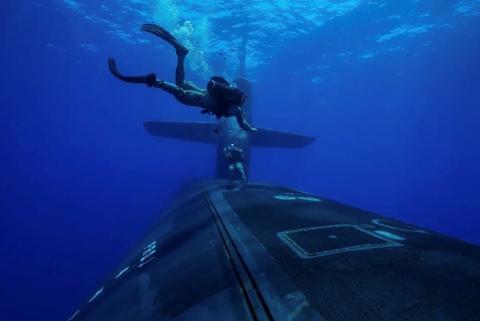 Marines from the Second Force Reconnaissance Company conduct dive operations with Ohio-class guided-missile submarine USS Georgia (SSGN 729) while underway in the Mediterranean Sea in July.