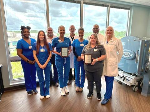 Camden Campus Wound Care Center employees Camille McGowan, Danielle Garza, Jim Hendrix, Ashley Holland, Benjamin Bograd, Soraya Williams, Damon Brantley, Jennifer Bailey and Donna Geiger share the National Award for Excellence in Wound Healing.
