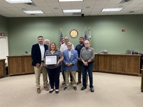 Camden County Senior Director of Human Resources and Risk Management Mike Spiers, Camden County Commissioner Lannie Brant, human resources generalist Amy Peeples, Chairman Ben Casey and Commissioners Martin Turner, Trevor Readdick and Jim Goodman celebrate a recent award.