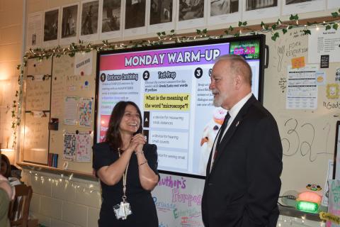 Camden Middle School sixth-grade English/language arts teacher Jenny Ritchotte, left, learns from Georgia Superintendent of Education Richard Woods that she’s been named a top-10 finalist for Georgia Teacher of the Year.