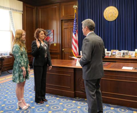 Gov. Brian Kemp, right, swears in Lydia Watkins, middle, dean of the School of Nursing and Health Sciences at the College of Coastal Georgia, to serve on the Georgia Board of Nursing. Watkins was accompanied by her daughter, Alyvia Watkins.