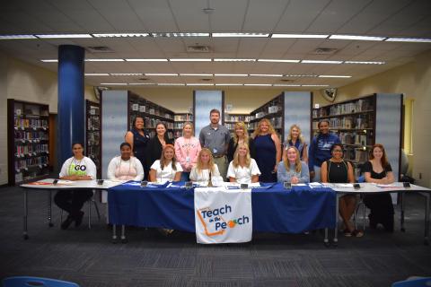 Eight Camden County High School seniors participated in the first-ever Teach in the Peach signing day May 6. Front row, from left, are Nikayla Campbell, Carmella Hutsell, Riley Copeland, Olivia Farrell, Claire McCullough, Lacey Mize, Akeelah Sawehinmi and Elie-Marie Turner. Back row: Sheri Pearson, Erika Smith, Stacie Faulk, James Phillips, Lisa Gleason, Heather Fitzwater, Tara Carter and Sharnesha Smith.