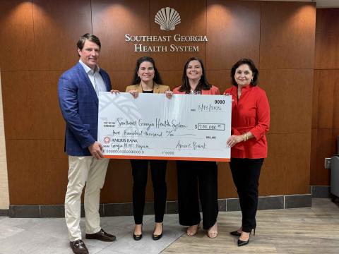 Ameris Bank Market President J. Brad Danowski, from left, Southeast Georgia Health System Interim President and CEO/Chief Legal Officer Christy Jordan, Ameris Bank Assistant Vice President/Branch Manager Shannon Yonce and Ameris Bank Senior Vice President of Commercial Lending Donna Gowen Poe celebrate a $200,000 Georgia HEART contribution to the hospital.