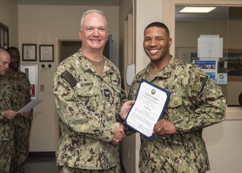 Former U.S. Navy Capt. Chris Bohner, left.