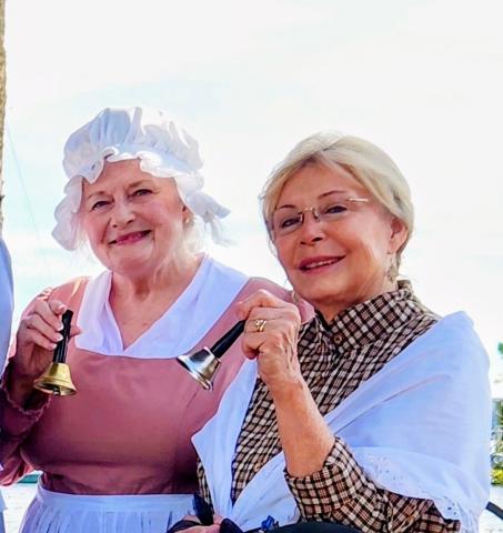 The Earl of Camden Chapter of the National Society of the Daughters of the American Revolution’s Pamela Kimes, left, and Maggie Williams, ring bells at a national bell ringing ceremony.
