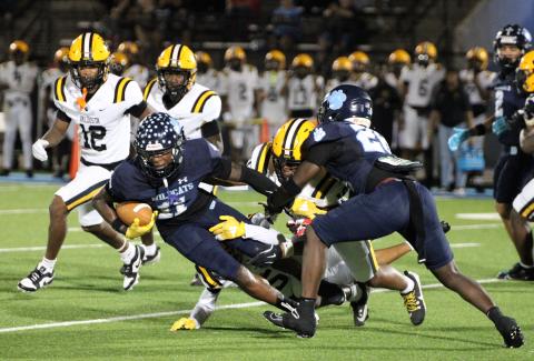 Camden County’s David Coleman falls forward for positive yardage Friday during a kickoff return during the Wildcats’ 63-19 loss to Valdosta at Chris Gilman Stadium.