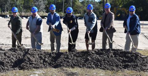 From left, Bryan James, B. James Construction (general contractor); Benjamin Starks, senior project manager, Jericho Design Group (architect); Kingsland Mayor Grayson Day; Kingsland Police Chief Rickey Evans; Alex Blount, Kingsland City Council; Paul Chamberlin, Kingsland City Council; and Kingsland City Manager Lee Spell break ground on the new city police headquarters.