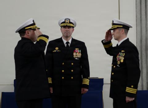 U.S. Navy Cmdr. Brian Ross, right, relinquishes command of the Ohio-class ballistic missile submarine, USS West Virginia (Gold), to Cmdr. Scott J. Tedrick during a change of command ceremony at Naval Submarine Base Kings Bay.