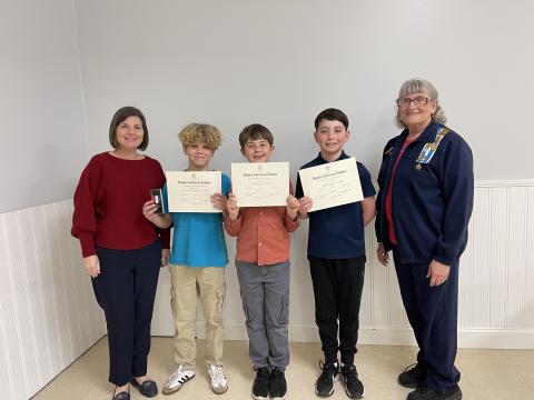 Earl of Camden Daughters of the American Revolution Essay Coordinator Ardith Sweatt stands with, from left, first-place winner Hudson DeBenedetto, second-place winner Riley Brewer, third-place winner Sawyer Coley and Chapter Regent Karen Kerner. 