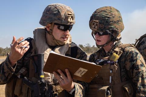 U.S. Marine Corps Capt. Ben Hicks, left, a dental officer with Combat Logistics Battalion 31, 31st Marine Expeditionary Unit, coordinates with U.S. Navy Lt. Katelyn Morton, an emergency nurse with CLB-31, 31st MEU, during a mass casualty exercise at Shoalwater Bay Training Area, Australia, on June 27, 2023.