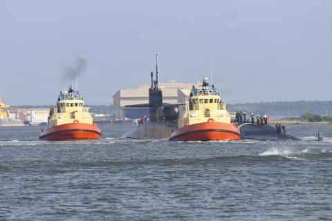 The Ohio-class guided-missile submarine USS Georgia transits the East River on Monday as she returns to her homeport at Naval Submarine Base Kings Bay.
