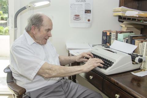 Fred Hill sits at his typewriter in his room at Magnolia Manor Senior Living in 2022. Hill, 88, was a longtime columnist for the Southeast Georgian and the Tribune & Georgian.