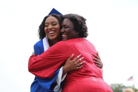 Fernandina Beach High School’s Kamryn Williams, left, is all smiles as she hugs her mother, teacher Keisha Williams, after receiving her diploma Monday morning.