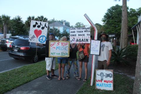 Picketers stood outside Fernandina Beach City Hall Tuesday as the City Commission discussed changes to the city’s noise ordinance. Some speakers at the meeting said they want a committee created to help craft an ordinance that would work for musicians, business owners and residents.