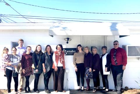 Several people join together to celebrate the opening of Barnabas’ new service center in Callahan, which is open by appointment to assist local residents. Call 904-261-7000 for assistance.