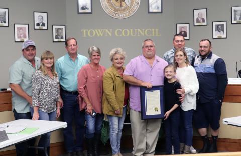 Hilliard Town Council President John Beasley is joined by family after receiving recognition for 20 years of service to the town. 