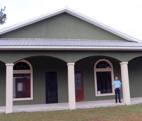 Rivers Edge Church Pastor Gerald Wollitz stands in front of the church’s new home at 552089 U.S. 1, Hilliard.